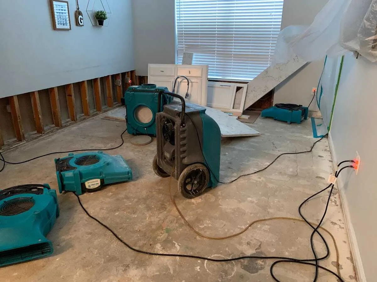 Dehumidifier in flood-cut room for Water Damage Restoration in East Riverdale